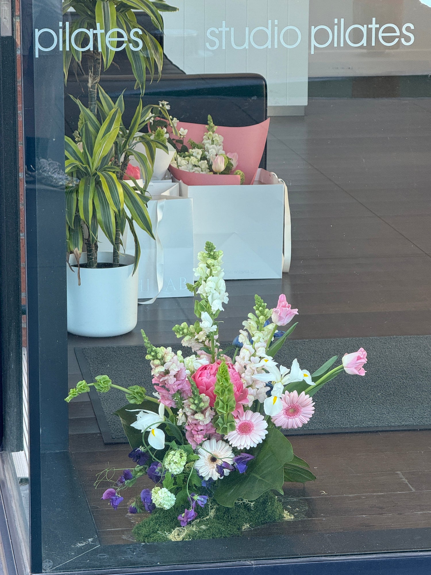 vent floral installation featuring seasonal flowers arranged for a styled display setting