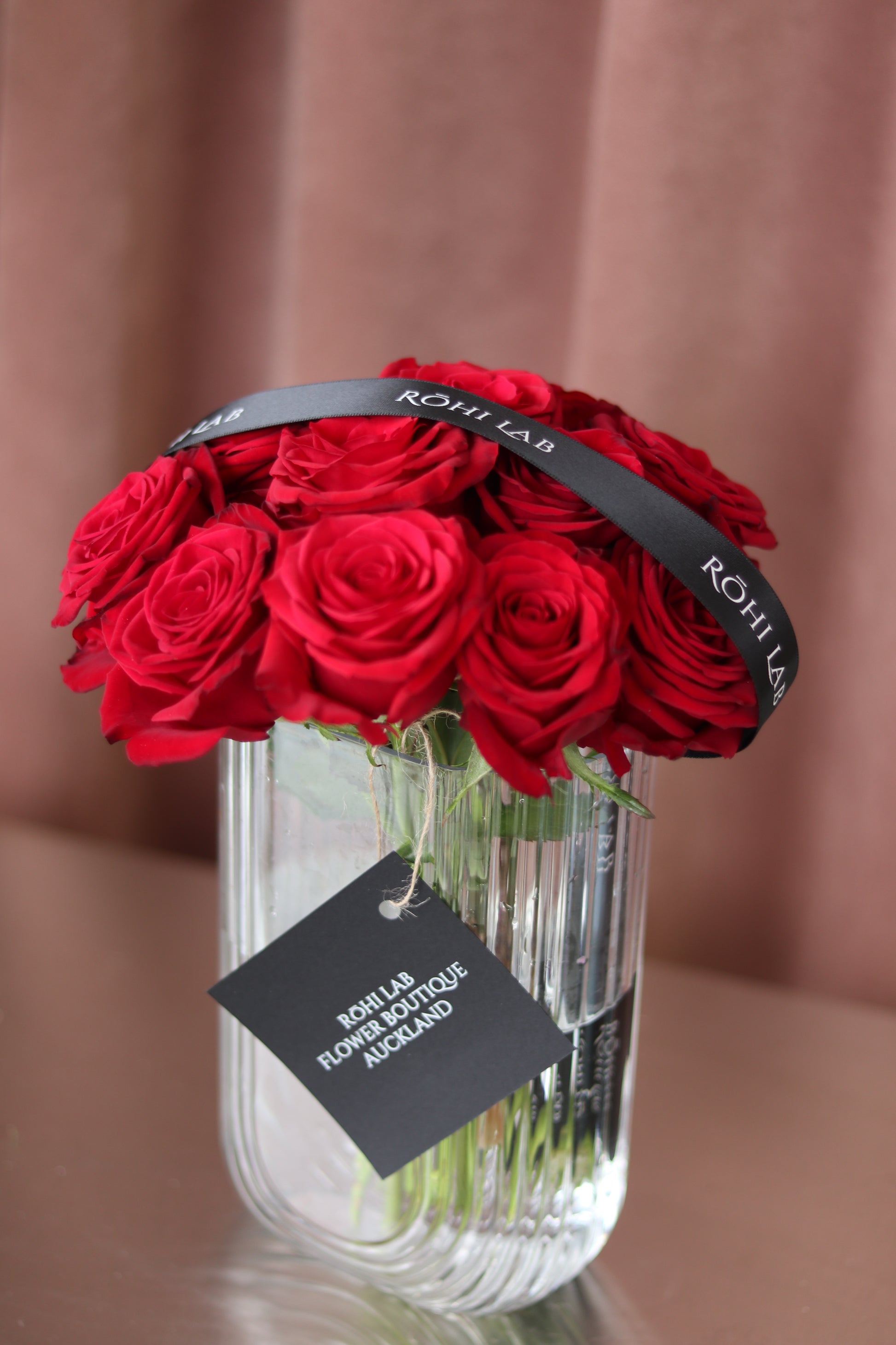 Luxury red roses styled in transparent vase for Valentine’s Day gifting