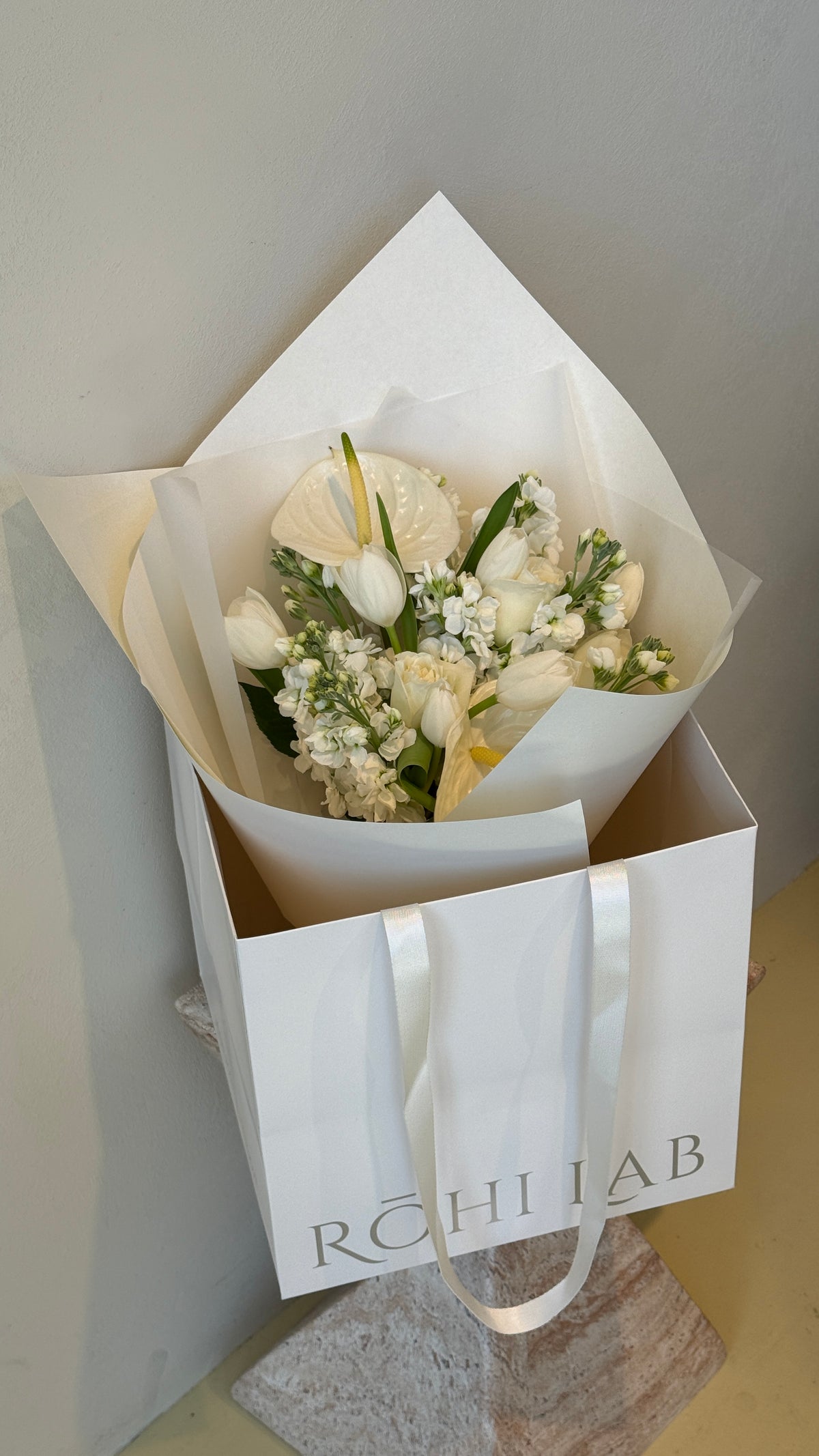 Ivory Garden White and Green Flower Bouquet featuring fresh white blooms and greenery in elegant white wrapping