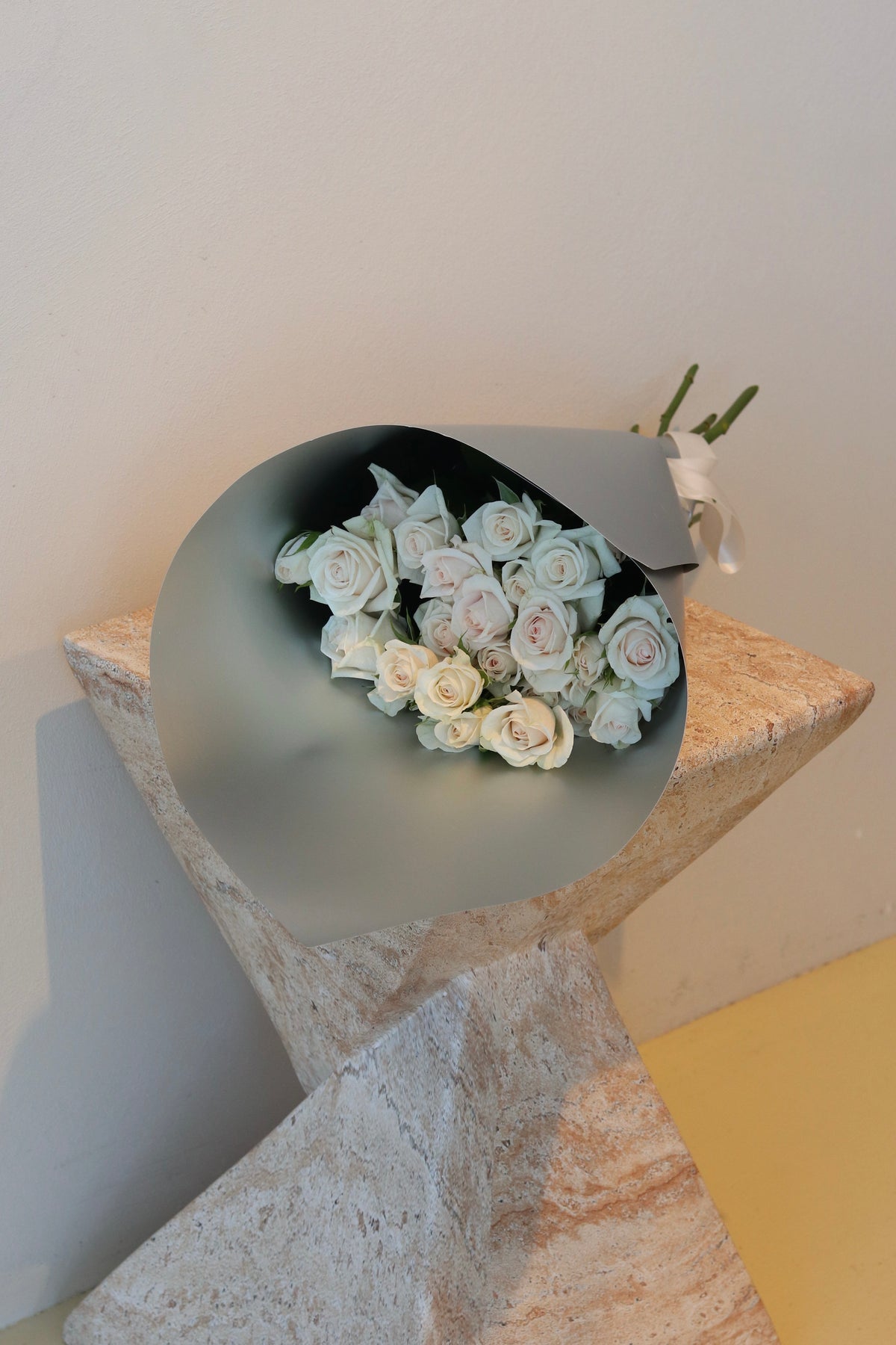 Rosy Muse Spray Rose Bouquet featuring soft white spray roses in elegant grey wrapping
