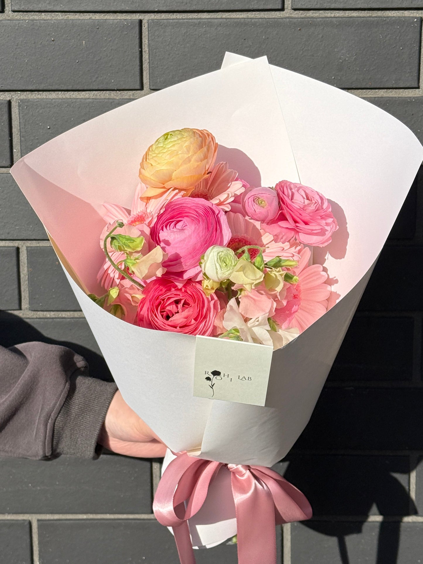 Petal Ballet ranunculus flower bouquet wrapped in white paper