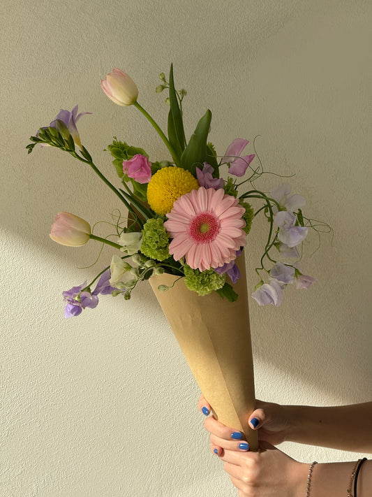 Custom ice cream bouquet with pastel seasonal flowers wrapped in a cone, handcrafted by Rōhi Lab in Auckland