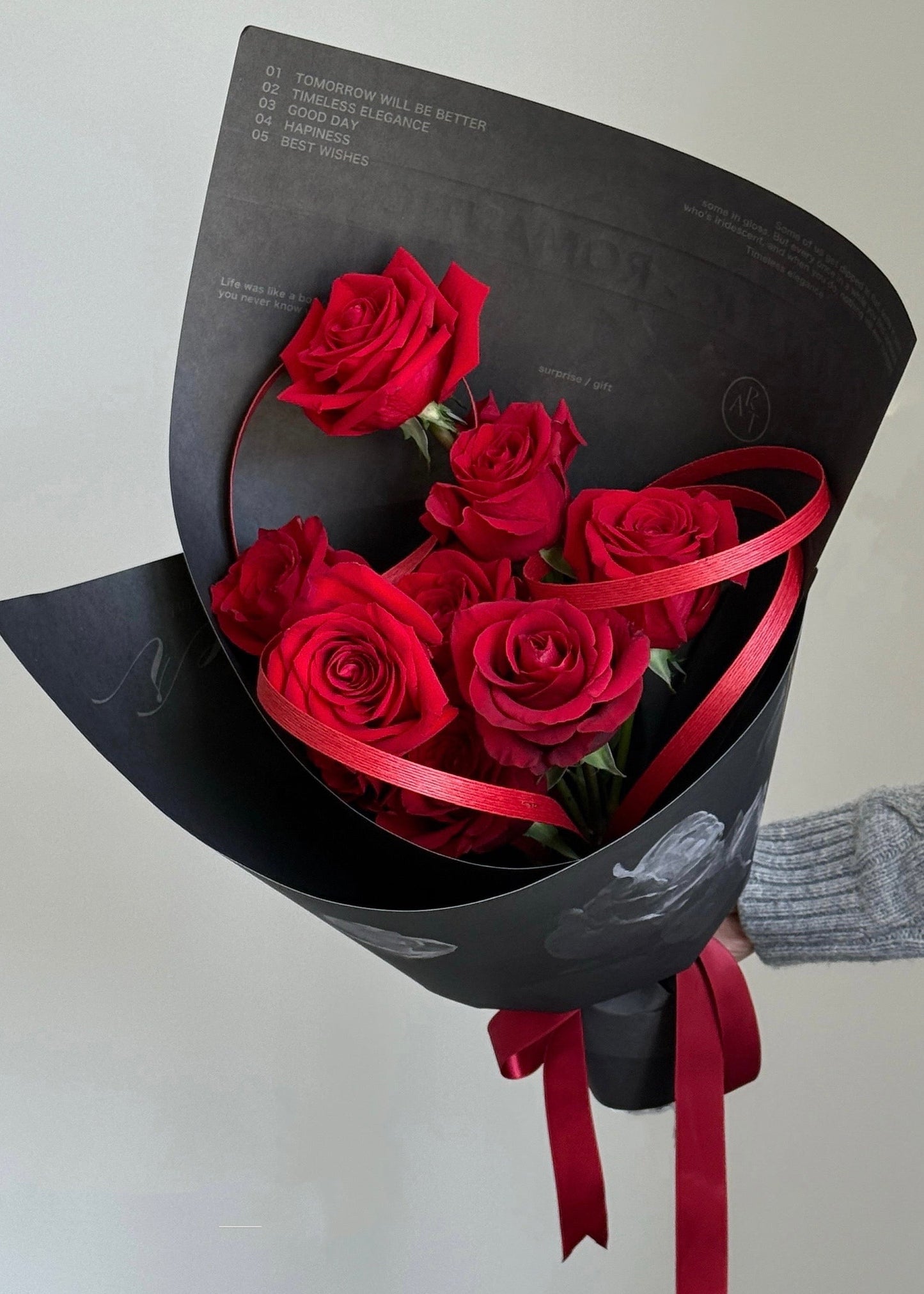 Valentine’s Day red rose bouquet wrapped in black paper, designed by RŌHI LAB in Auckland
